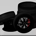Stacked Black Car Tires with Alloy Rims and Red Brake Calipers