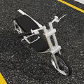 Modern Motorcycle With Silver Frame Black Seat On Road With Yellow Lines