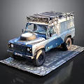 Vintage Blue Silver Off Road Vehicle With Roof Rack Front Spare Tire On Stone Pavement