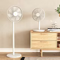 Modern Air Cooler Fans Standing And Table Types In Home Interior With Wooden Cabinet Decor
