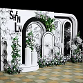 Elegant Wedding Backdrop With White Arch Green Plants And Floral Decorations On Checkerboard Floor
