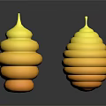 Two Yellow Spiral Stacked Sculptures With Reflective Bases On Dark Surface