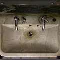 Vintage Ceramic Washbasin With Double Faucets Stained Surface And Exposed Pipes