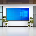 Public Facility Lobby Featuring Large Blue Screen Display Green Plants And Glass Doors