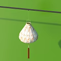 White Lantern With Golden Patterns And Red Tassel Hanging On Green Background