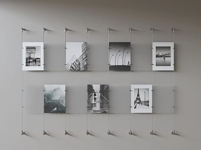 Black And White Photo Wall With Hanging Scenery And Architecture Photos Using Metal Hooks And Lines 3d model