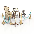 Classical Style Furniture Display With Ornate Armchair Small Round Table Golden Stanchions And Blue Ropes