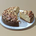 Freshly Baked Round Cake With Nut Toppings On White Plate And Sliced Piece