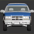 Blue and Brown SUV Toy Model with White Roof Rack and Wheels