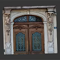 Antique Entrance Door With Wooden Double Doors Green Ironwork And Carved Stone Frame