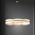 Modern Circular Multi Layered Chandelier With White Shade Gold Accents Suspended In Room