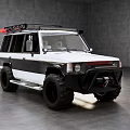 White and Black Off Road Vehicle With Roof Rack and Large Tires in Indoor Setting