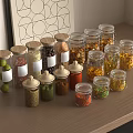 Decorative Glass Spice Jars Filled With Various Spices On Wooden Kitchen Countertop