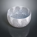 Intricate Carved Silver Bowl Sculpture With Detailed Patterns And Reflective Surface