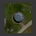 Stone Windmill Building With Dome Roof Stone Walls Grassland Pathway And Wooden Door