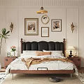Double Bed with Black Leather Headboard White Floral Sheets and Wooden Nightstand