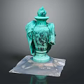 Turquoise Vase Shaped Sculpture Carving with Figural Details and Transparent Base on Black Background
