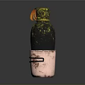 Stylish Decorative Bottle With Copper Base Black Gold Accents And Orange Decorative Detail