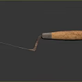 Rusty Trowel With Metal Blade And Wooden Handle On Dark Background With Reflection