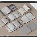 Open Books and Magazines Display on Wooden Table with Various Covers and Pages