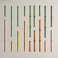 Various Colored Bamboo Poles Arranged in Display with Green Pink Yellow Brown Tones