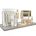 Fashion Store Display Arrangement With Multiple Mannequins Wooden Stump Bases And Clothing Racks