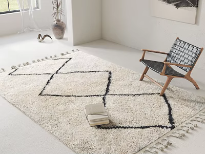 Ivory Square Rug With Black Geometric Pattern And Tassels Next To Woven Chair In Living Space 3d model