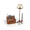 Open Vintage Leather Trunk With Coiled Snake Candelabra And Red Pipe