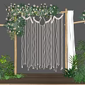 Elegant Floral Installation For Wedding With Wooden Frame Macramé Tassels White Drapes And Green Foliage