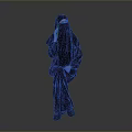 Child In Traditional Black Robe Standing Against Gray Background Full View