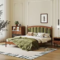 Double Bed With Green Quilt Wooden Headboard In Cozy Bedroom Framed Artwork Plant And Rug