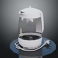 White Electric Kettle With Transparent Body And Power Cord On Black Base