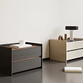 Modern Bedside Nightstands Design With Black Beige Wooden Drawers White Cup Books And Lamp