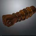 Human Hand Fist Wearing Multiple Golden And Brown Bracelets On Dark Background