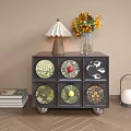 Modern Bedside Cabinet With Six Patterned Drawers White Lampshade Sunflower Vase And Stack Of Books
