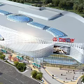 Modern Commercial Complex With Glass Facade Green Surroundings And Parking Area