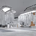 Modern Bright Clothing Store Interior With Hanging White Apparel And Metal Racks