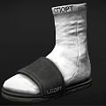 White Sport Sock Style Shoe With Black Strap And Rubber Sole Design