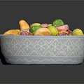 White Decorative Bowl With Snowflake Pattern Filled Colorful Gold Green Pink Wrapped Candies