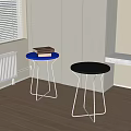 Modern Round Stools With Blue And Black Tops And Metal Frames In Room Corner