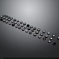 Round Black and Silver Automotive Parts Various Sizes Irregular Curved Arrangement Gray Background