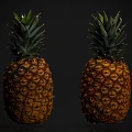 Two Fresh Ripe Pineapples With Green Crowns Displayed On Black Background