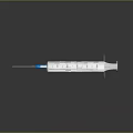 Medical Syringe With Blue Plunger Needle And Graduation Marks On Dark Background