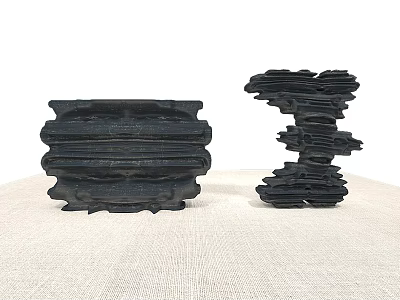 Black Rockery Stones With Layered Texture As Decorative Ornaments On Linen Surface 3d model