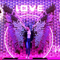 Valentine's Day Photo Spot with Neon Wings Heart Decoration and Pink Checkerboard Floor