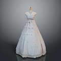 Elegant White Lace Gown With Fluffy Skirt And Decorations On Mannequin