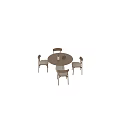 Round Wooden Dining Table with Four Chairs Light Colored Cushions and White Vase Dried Branches