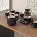 Black Tea Set On Wooden Table With Electric Kettle Tea Cups And Geometric Wall Decor
