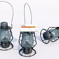 Three Vintage Kerosene Lanterns Two Standing One Lying With Metal Frames Glass Shades