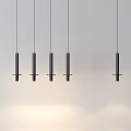 Modern Black Cylindrical Pendant Light With Textured Surface And Circular Base On Light Colored Wall